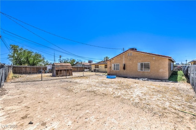 844 Balzar Ave, Las Vegas, NV 89106 - rear view of property featuring stucco siding and a fenced backyard