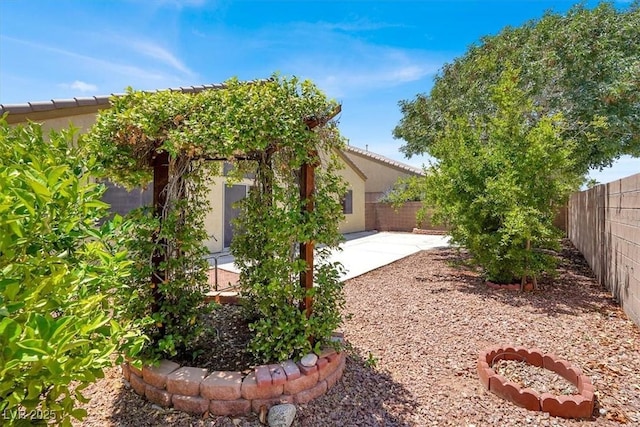 1212 E Rome Blvd, North Las Vegas, NV 89086 - fenced backyard with a patio area