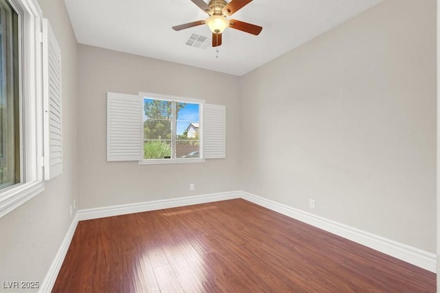 1212 E Rome Blvd, North Las Vegas, NV 89086 - empty room with dark wood-style flooring, baseboards, and a ceiling fan