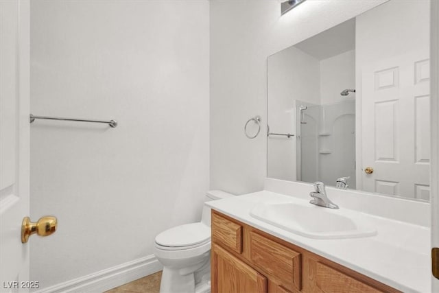 1212 E Rome Blvd, North Las Vegas, NV 89086 - bathroom featuring toilet, vanity, a shower, baseboards, and tile patterned floors