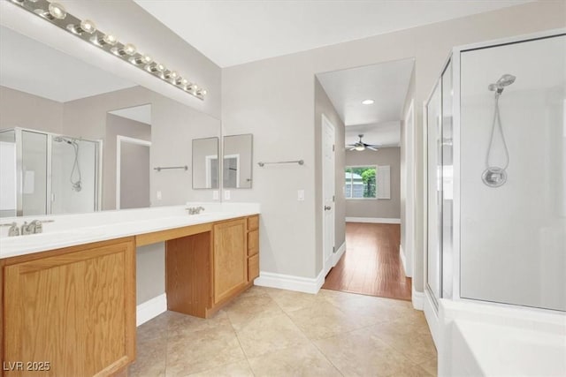 1212 E Rome Blvd, North Las Vegas, NV 89086 - full bathroom with a shower stall, double vanity, tile patterned floors, baseboards, and recessed lighting