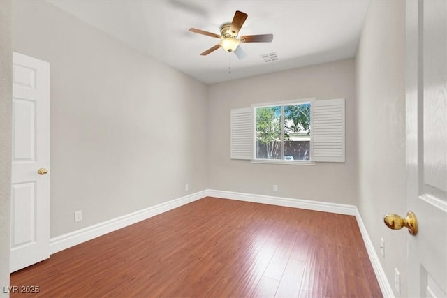 1212 E Rome Blvd, North Las Vegas, NV 89086 - spare room with wood finished floors, ceiling fan, and baseboards