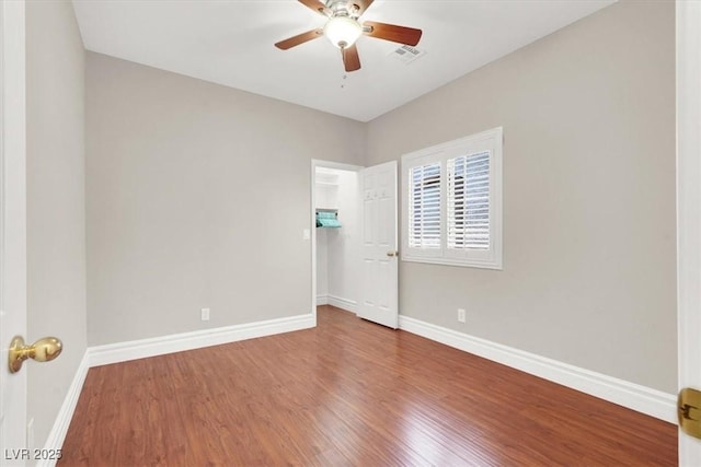 1212 E Rome Blvd, North Las Vegas, NV 89086 - spare room with wood finished floors, baseboards, and ceiling fan