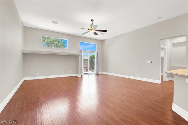 1212 E Rome Blvd, North Las Vegas, NV 89086 - empty room with ceiling fan, wood finished floors, and baseboards