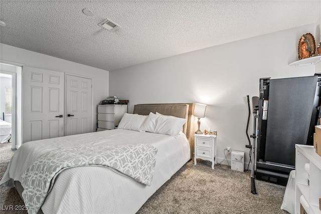 2507 Albemarle Way, Henderson, NV 89014 - bedroom with carpet flooring, a textured ceiling, and a closet