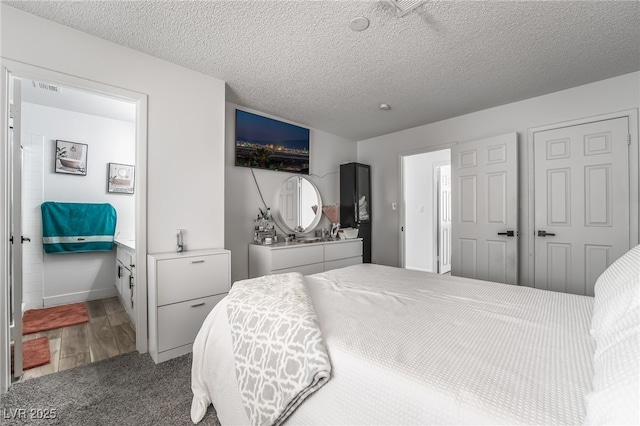 2507 Albemarle Way, Henderson, NV 89014 - bedroom with wood finished floors, a textured ceiling, and baseboards