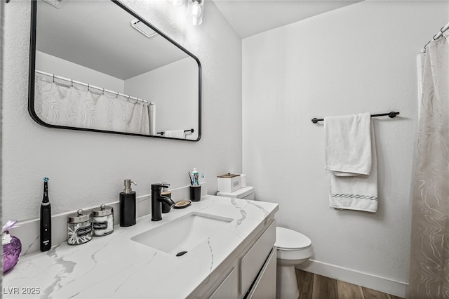 2507 Albemarle Way, Henderson, NV 89014 - full bath featuring toilet, wood finished floors, vanity, and baseboards