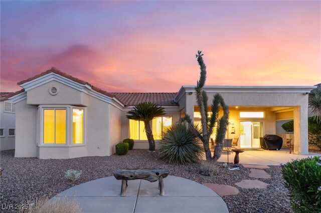 9812 Folsom Dr, Las Vegas, NV 89134 - view of front of property featuring stucco siding, a tiled roof, and a patio