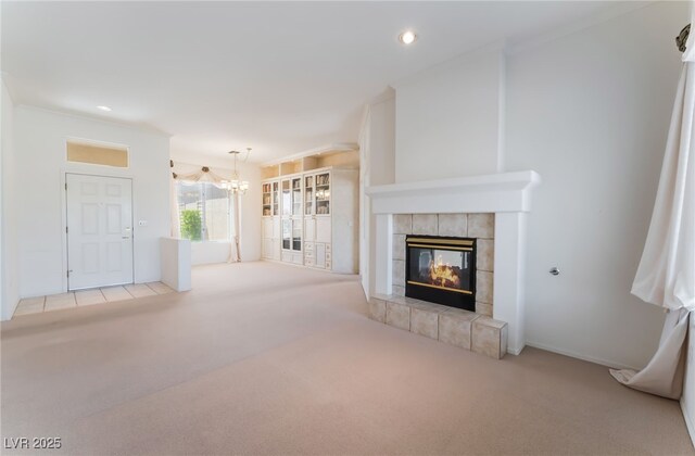 9812 Folsom Dr, Las Vegas, NV 89134 - unfurnished living room with carpet, a chandelier, a fireplace, and recessed lighting