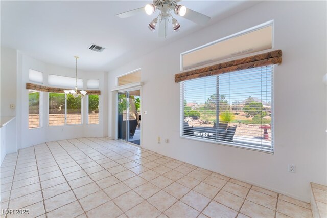 9812 Folsom Dr, Las Vegas, NV 89134 - empty room with a chandelier, ceiling fan, and light tile patterned flooring