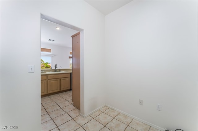 9812 Folsom Dr, Las Vegas, NV 89134 - spare room with a sink, light tile patterned floors, recessed lighting, and baseboards