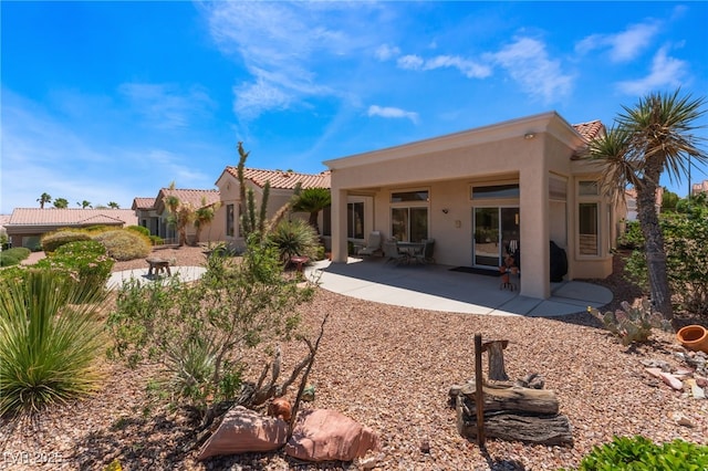 9812 Folsom Dr, Las Vegas, NV 89134 - back of house featuring stucco siding, a patio area, and a tiled roof