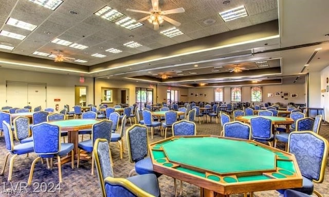 9812 Folsom Dr, Las Vegas, NV 89134 - game room featuring ceiling fan, a tray ceiling, carpet flooring, plenty of natural light, and a drop ceiling