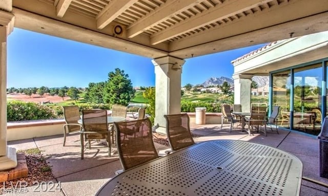 9812 Folsom Dr, Las Vegas, NV 89134 - view of patio with outdoor dining space and a mountain view