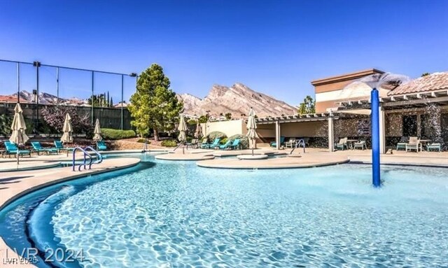 9812 Folsom Dr, Las Vegas, NV 89134 - community pool featuring a pergola, a patio area, and a mountain view