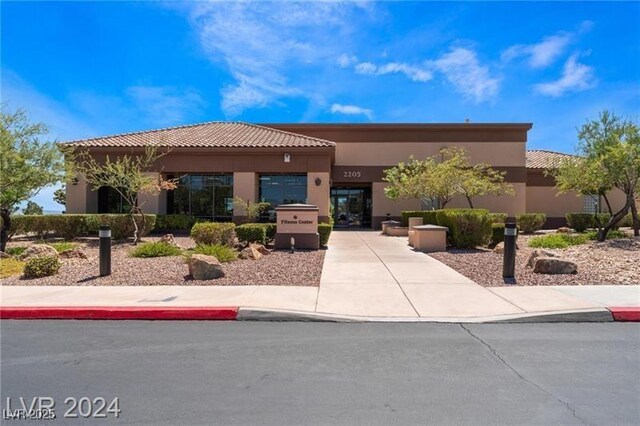 9812 Folsom Dr, Las Vegas, NV 89134 - view of front facade with stucco siding and a tiled roof