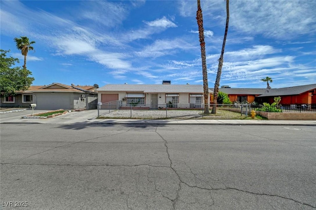 4067 E Colorado Ave, Las Vegas, NV 89104 - ranch-style home with a fenced front yard, a garage, and concrete driveway