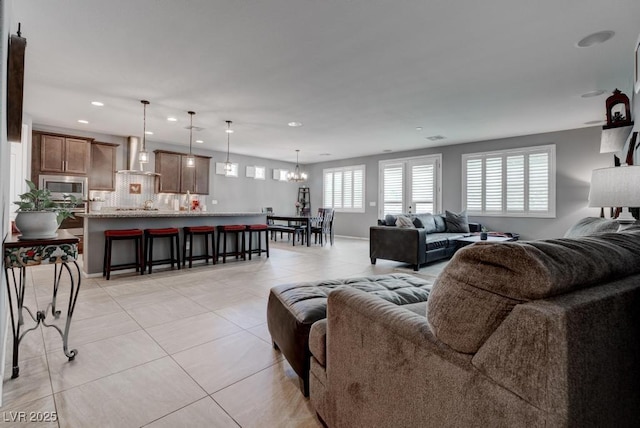 6985 Hopi Summit Ct, Las Vegas, NV 89149 - living area featuring recessed lighting, a chandelier, and light tile patterned flooring