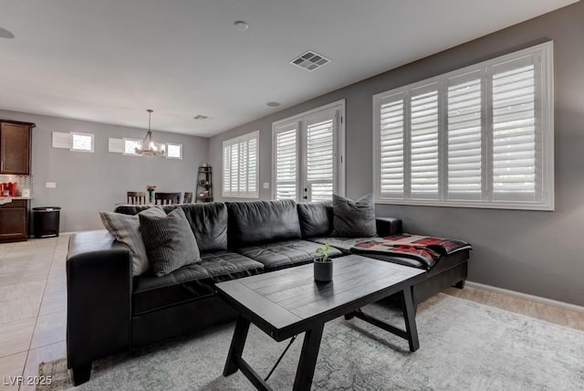 6985 Hopi Summit Ct, Las Vegas, NV 89149 - living room with a chandelier and baseboards