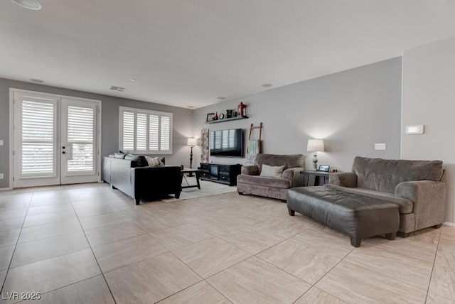 6985 Hopi Summit Ct, Las Vegas, NV 89149 - living area with french doors and light tile patterned floors