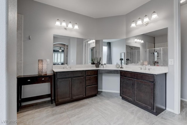 6985 Hopi Summit Ct, Las Vegas, NV 89149 - bathroom featuring a stall shower, vanity, and baseboards