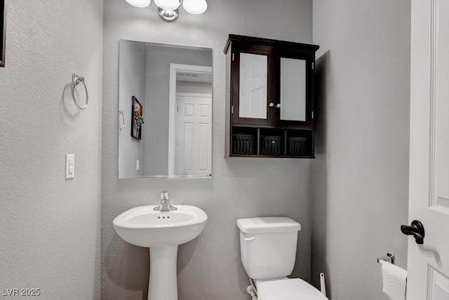 6985 Hopi Summit Ct, Las Vegas, NV 89149 - bathroom with toilet and a sink