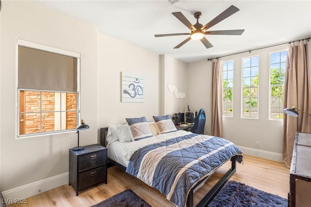 10301 Orkiney Dr, Las Vegas, NV 89144 - bedroom with baseboards, light wood-style floors, and a ceiling fan
