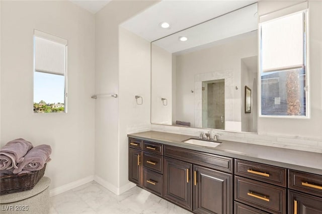 10301 Orkiney Dr, Las Vegas, NV 89144 - full bathroom featuring vanity, marble finish floors, recessed lighting, baseboards, and a shower