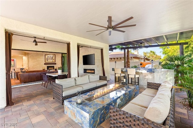 10301 Orkiney Dr, Las Vegas, NV 89144 - view of patio / terrace featuring an outdoor living space with a fireplace, exterior bar, and an outdoor kitchen