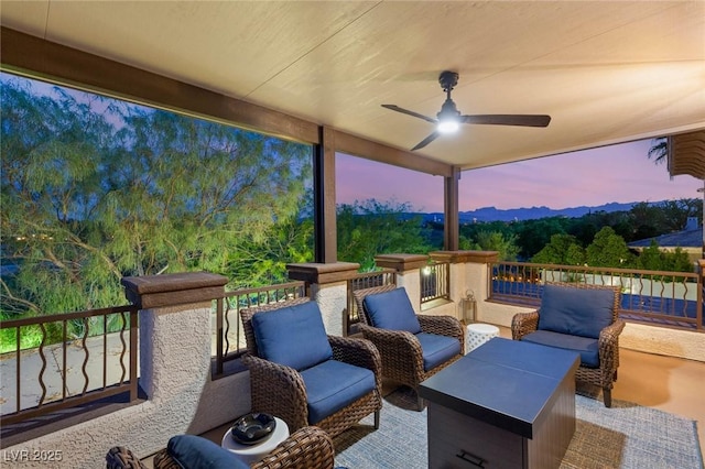 10301 Orkiney Dr, Las Vegas, NV 89144 - patio terrace at dusk featuring ceiling fan and outdoor lounge area