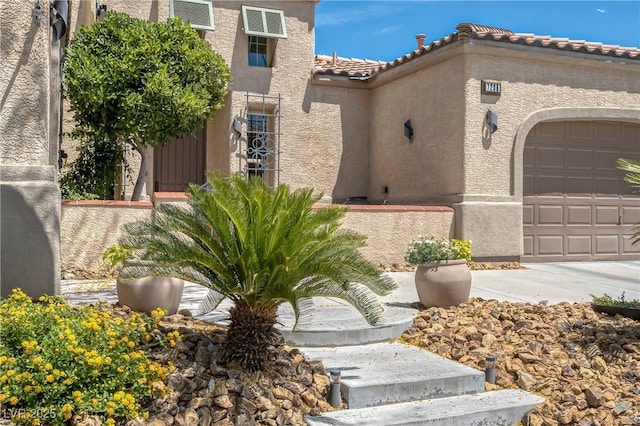 7206 Laramie Ave, Las Vegas, NV 89113 - view of front of house with a garage, stucco siding, and a tiled roof
