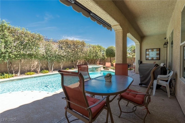 7206 Laramie Ave, Las Vegas, NV 89113 - fenced backyard with a patio, a pool with connected hot tub, and a grill