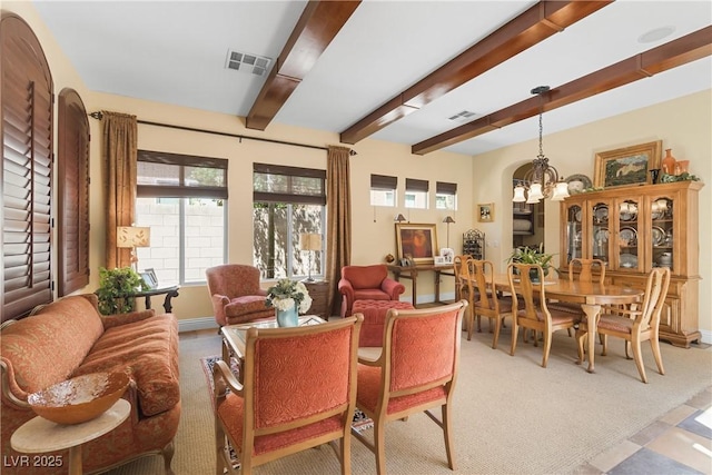 7206 Laramie Ave, Las Vegas, NV 89113 - living area featuring a chandelier, beamed ceiling, baseboards, and light colored carpet