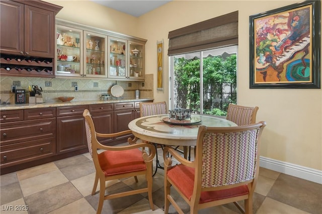 7206 Laramie Ave, Las Vegas, NV 89113 - dining area with baseboards and bar