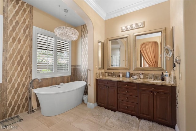 7206 Laramie Ave, Las Vegas, NV 89113 - bathroom featuring a soaking tub, crown molding, double vanity, and a wainscoted wall