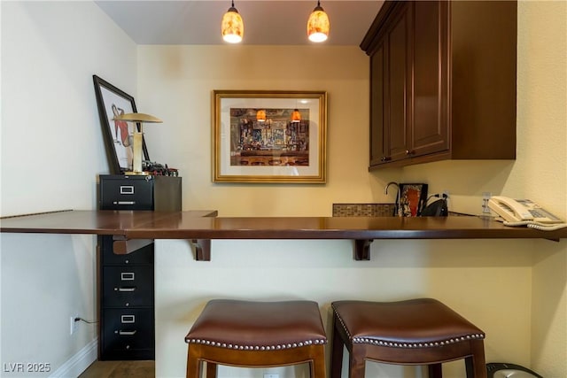 7206 Laramie Ave, Las Vegas, NV 89113 - bar area with hanging light fixtures and baseboards