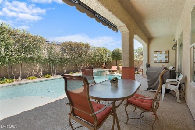 7206 Laramie Ave, Las Vegas, NV 89113 - fenced backyard featuring a patio and a pool with connected hot tub