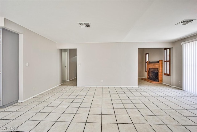 3596 Bronco Rd, Las Vegas, NV 89103 - empty room with a fireplace and baseboards