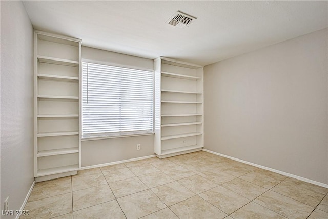 3596 Bronco Rd, Las Vegas, NV 89103 - empty room featuring tile patterned flooring and baseboards