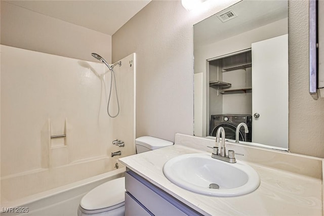 3596 Bronco Rd, Las Vegas, NV 89103 - bathroom with washer / clothes dryer, toilet,  shower combination, and vanity