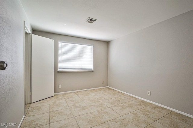 3596 Bronco Rd, Las Vegas, NV 89103 - empty room featuring light tile patterned floors and baseboards