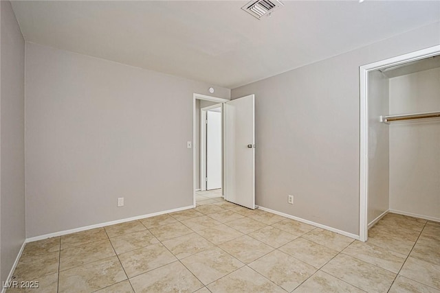 3596 Bronco Rd, Las Vegas, NV 89103 - unfurnished bedroom with light tile patterned floors, a closet, and baseboards