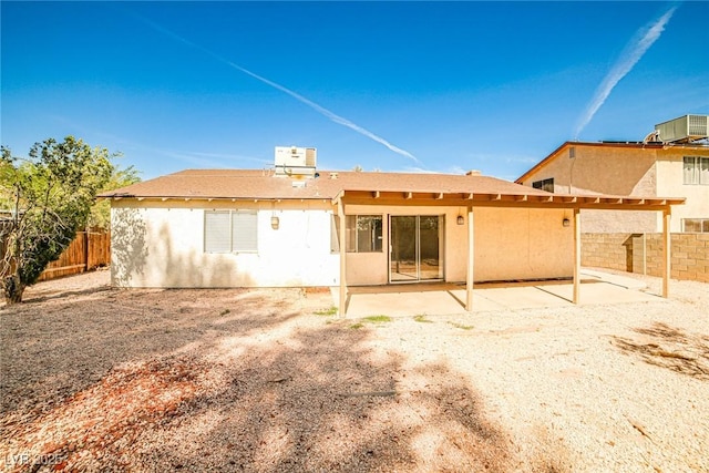 3596 Bronco Rd, Las Vegas, NV 89103 - back of property with a fenced backyard, a patio, and central AC unit