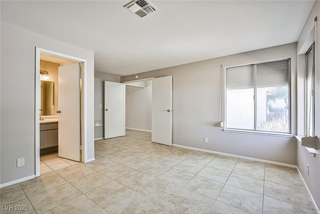 3596 Bronco Rd, Las Vegas, NV 89103 - unfurnished bedroom featuring light tile patterned floors and baseboards