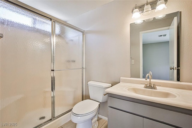 3596 Bronco Rd, Las Vegas, NV 89103 - bathroom featuring a stall shower, vanity, toilet, and tile patterned flooring