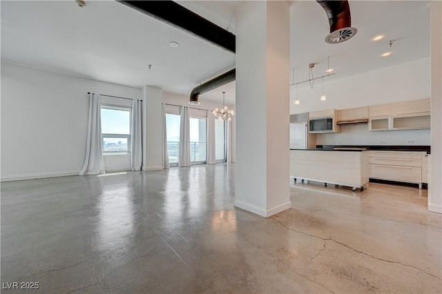 200 Hoover Ave Unit 1905, Las Vegas, NV 89101 - unfurnished living room featuring concrete floors, a chandelier, baseboards, and a high ceiling