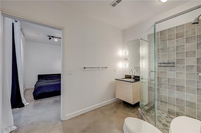 200 Hoover Ave Unit 1905, Las Vegas, NV 89101 - bathroom with toilet, finished concrete floors, vanity, and a shower stall