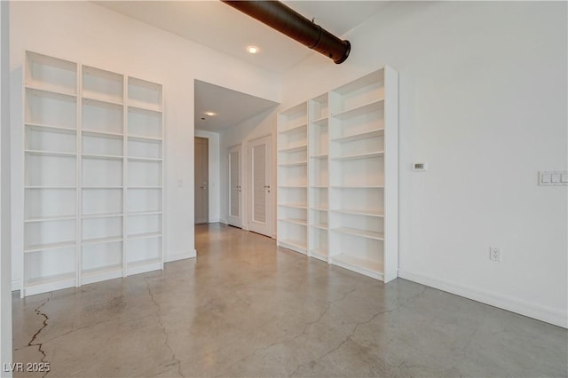 200 Hoover Ave Unit 1905, Las Vegas, NV 89101 - spare room featuring concrete floors, baseboards, built in shelves, and recessed lighting