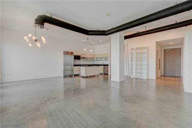 200 Hoover Ave Unit 1905, Las Vegas, NV 89101 - unfurnished living room featuring a chandelier, concrete floors, a towering ceiling, and baseboards