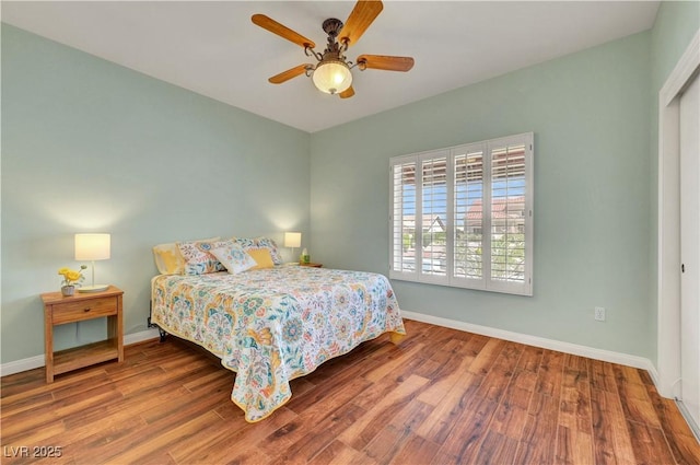 2805 Hanging Rock Dr, Las Vegas, NV 89134 - bedroom with wood finished floors, baseboards, and a ceiling fan